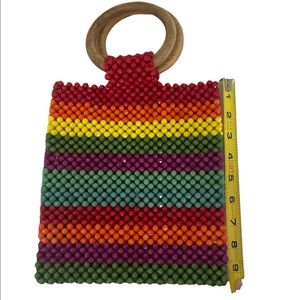 Beaded bag.  Wooden handles.